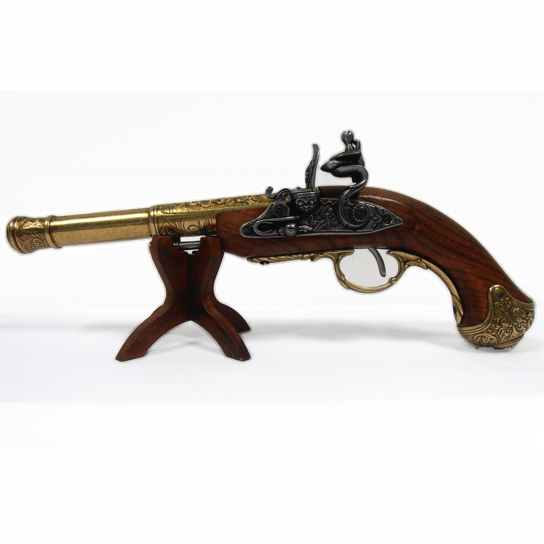 Pistola de chispa zurda de madera y metal acabado latón, India S. XVIII